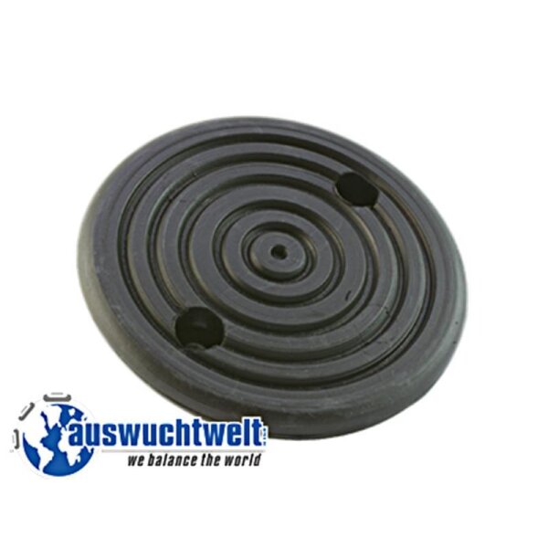 Das Bild zeigt eine schwarze, runde Gummischeibe mit mehreren konzentrischen Rillen auf der Oberfläche. Die Scheibe hat zwei größere Löcher, die gegenüberliegen, sowie ein kleines Loch in der Mitte. Unten links im Bild ist ein Logo mit der Darstellung einer blauen Weltkugel und dem Schriftzug „auswuchtwelt – we balance the world“ zu sehen. Das Objekt wirkt robust und könnte als Auswuchtgewicht oder Teil eines technischen Geräts verwendet werden. Der Hintergrund ist weiß.