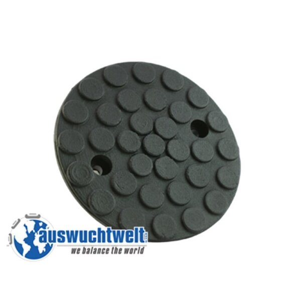 Das Bild zeigt eine runde, schwarze Kunststoff- oder Gummischeibe mit vielen kleinen, runden Pads auf der Oberfläche, die vermutlich zum Schutz oder für besseren Halt dienen. Die Scheibe hat zwei runde Löcher, die wahrscheinlich zur Befestigung oder zum Einrasten verwendet werden. Unten links im Bild sind ein blau-weißer Globus und der Schriftzug auswuchtwelt zu sehen, darunter der Slogan we balance the world. Die Scheibe könnte ein Teil für Maschinen oder Werkzeuge sein, zum Beispiel für das Auswuchten von Reifen oder ähnlichem.