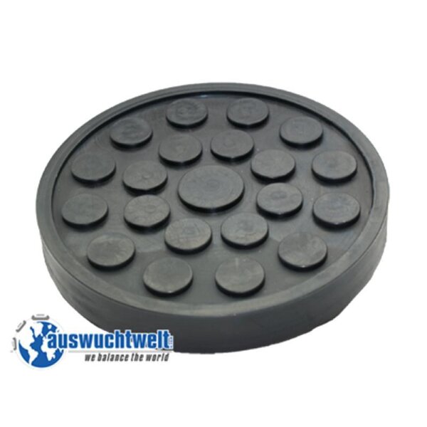 Das Bild zeigt eine runde, schwarze Gummimatte oder Gummiplatte. Auf der Oberfläche der Matte sind viele runde, erhöhte Noppen verteilt. Insgesamt sind es 19 Noppen, die unterschiedliche Größen haben und kreisförmig angeordnet sind. Die Matte hat einen etwa 3 bis 4 Zentimeter hohen Rand. In der linken unteren Ecke des Bildes befindet sich ein Logo mit der Aufschrift „auswuchtwelt - we balance the world“. Die Matte wirkt robust und ist vermutlich ein Werkzeug oder Zubehör für mechanische oder industrielle Anwendungen, zum Beispiel als Unterlage für Maschinen oder Werkzeuge.