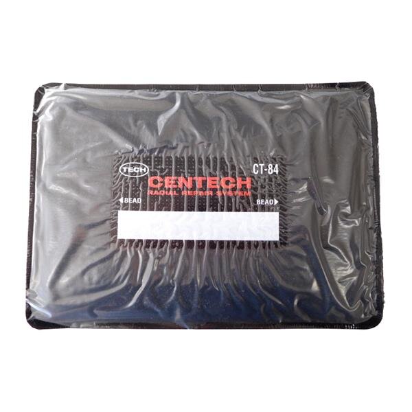Das Bild zeigt ein rechteckiges, schwarzes Produkt in einer durchsichtigen Plastikverpackung. In der Mitte befindet sich ein Aufdruck mit der Aufschrift CENTECH RADIAL REPAIR SYSTEM in roten und weißen Buchstaben sowie die Bezeichnung CT-84. Das Produkt wirkt flach und flexibel.