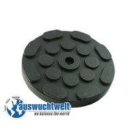 Das Bild zeigt eine runde schwarze Gummiauflage mit...