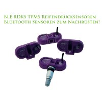 Auf dem Bild sind vier lilafarbene Reifendrucksensoren zu...